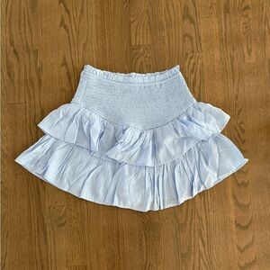 Light blue ruffle tennis skirt with built-in shorts. Size: M